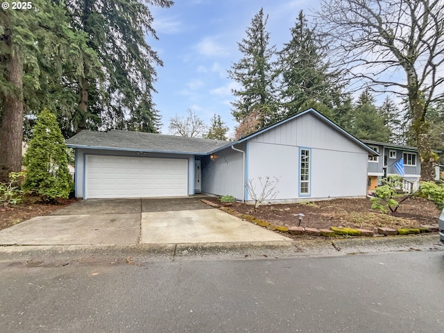 view of front of house featuring a garage and concrete driveway