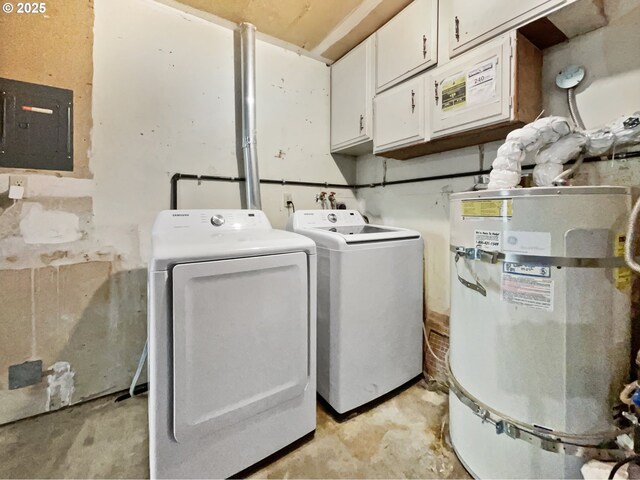 laundry area featuring electric panel, washing machine and dryer, cabinet space, and water heater