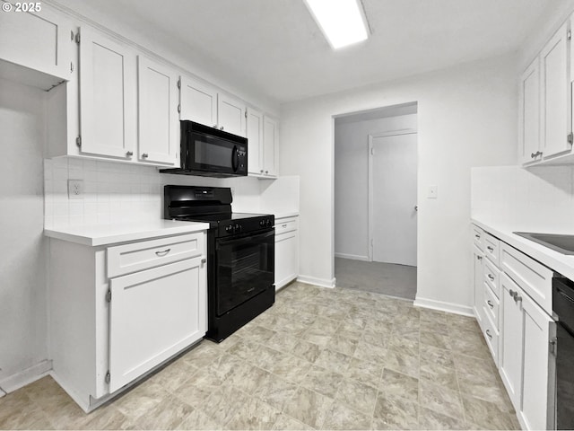 kitchen featuring baseboards, decorative backsplash, black appliances, light countertops, and white cabinetry