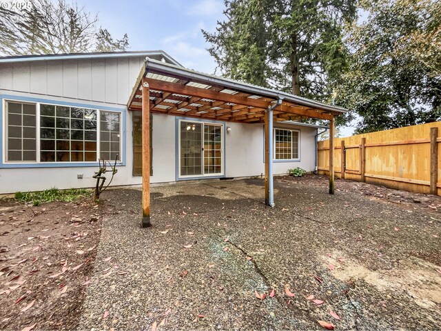 back of house with fence