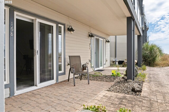 168 N Pacific St, Rockaway Beach, OR 97136 - garage featuring electric panel and a garage door opener