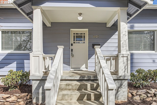 doorway to property with covered porch