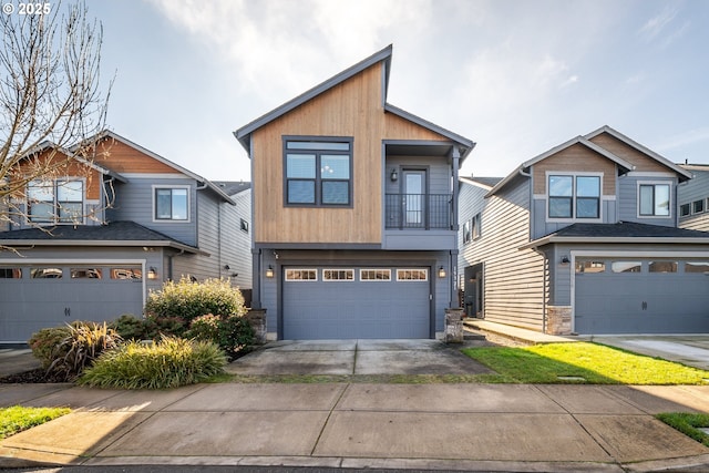 view of front of house featuring a garage and a balcony