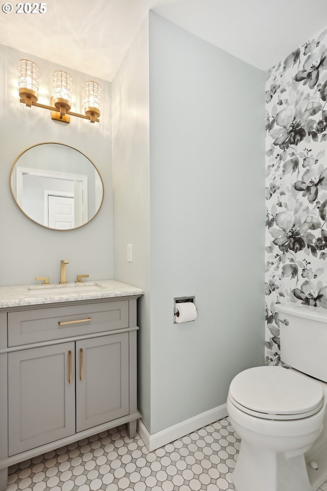 315 W 13th St, The Dalles, OR 97058 - bathroom with vanity, toilet, and baseboards