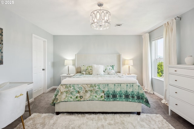 315 W 13th St, The Dalles, OR 97058 - bedroom with carpet, baseboards, and a chandelier