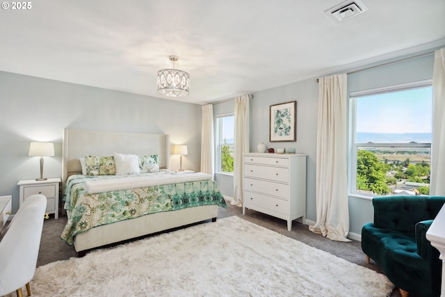 315 W 13th St, The Dalles, OR 97058 - bedroom with carpet flooring, a chandelier, and baseboards