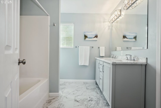 315 W 13th St, The Dalles, OR 97058 - full bath with marble finish flooring, double vanity, baseboards, and shower / bath combination