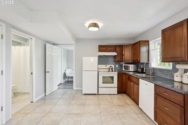 315 W 13th St, The Dalles, OR 97058 - kitchen with white appliances, a sink, under cabinet range hood, and decorative backsplash
