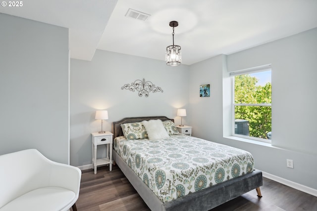 315 W 13th St, The Dalles, OR 97058 - bedroom featuring dark wood-style flooring and baseboards