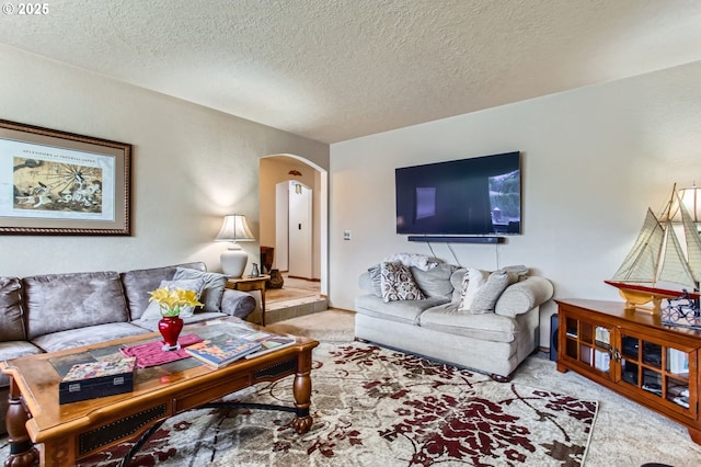 1473 N Locust St, Canby, OR 97013 - carpeted living room with arched walkways and a textured ceiling