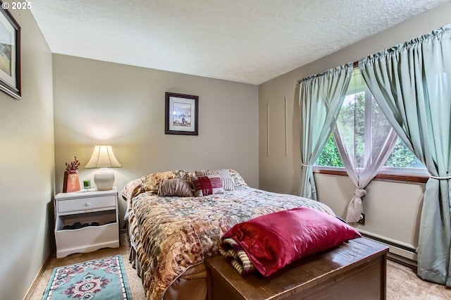 1473 N Locust St, Canby, OR 97013 - bedroom featuring baseboard heating, light colored carpet, and a textured ceiling