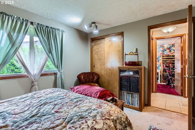 1473 N Locust St, Canby, OR 97013 - carpeted bedroom with a textured ceiling and a closet