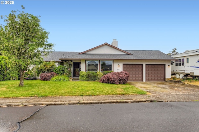 1473 N Locust St, Canby, OR 97013 - view of front of house with a garage, driveway, a front lawn, a chimney, and stucco siding