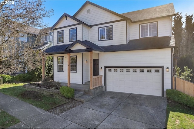 view of front of home with a garage, roof with shingles, a porch, and concrete driveway