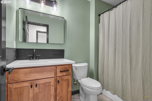 bathroom with vanity, toilet, and a shower with curtain