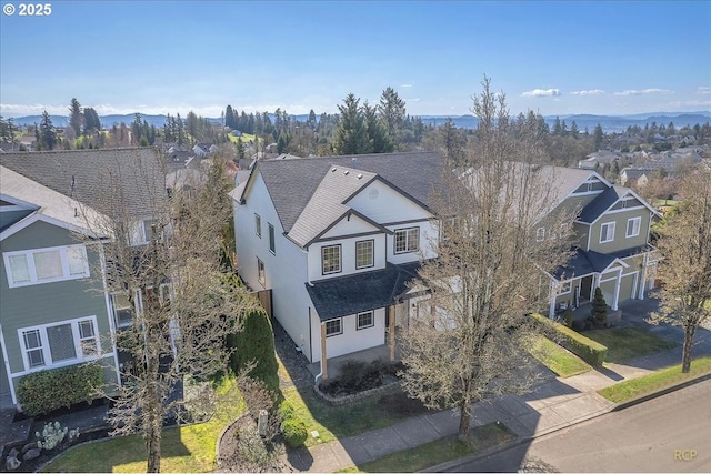 birds eye view of property with a residential view