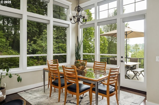 10448 SE 147th Ave, Happy Valley, OR 97086 - sunroom with plenty of natural light, a chandelier, and french doors
