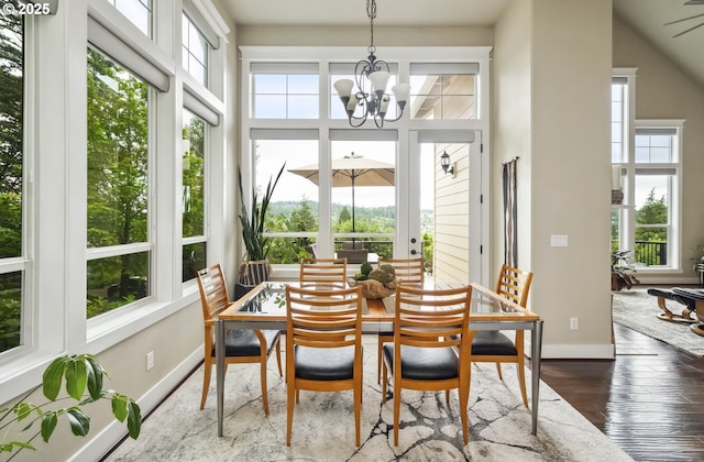 10448 SE 147th Ave, Happy Valley, OR 97086 - dining space featuring a chandelier, baseboards, and dark wood-style flooring