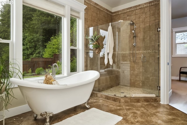 10448 SE 147th Ave, Happy Valley, OR 97086 - full bathroom with a soaking tub, a stall shower, baseboards, and tile patterned flooring