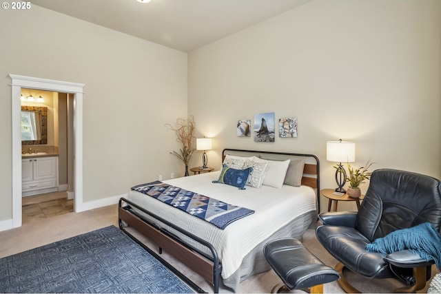 10448 SE 147th Ave, Happy Valley, OR 97086 - bedroom featuring carpet flooring, baseboards, a sink, and ensuite bath