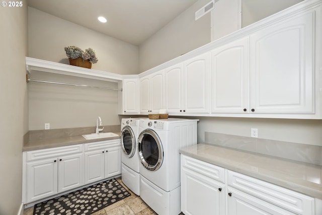 10448 SE 147th Ave, Happy Valley, OR 97086 - washroom featuring independent washer and dryer, cabinet space, and recessed lighting