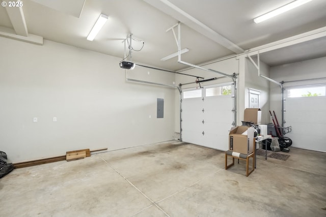 10448 SE 147th Ave, Happy Valley, OR 97086 - garage featuring a garage door opener and electric panel