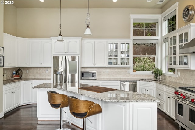 10448 SE 147th Ave, Happy Valley, OR 97086 - kitchen featuring appliances with stainless steel finishes, a sink, decorative backsplash, recessed lighting, and white cabinets