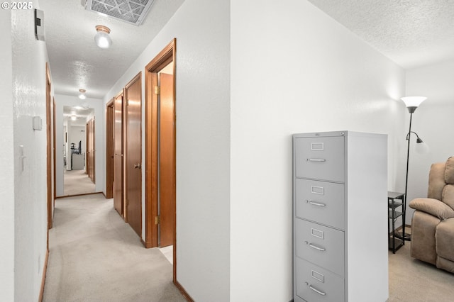 4775 Sienna Dr NE, Salem, OR 97301 - corridor with a textured ceiling and light carpet