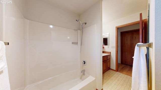 bathroom with vanity and bathing tub / shower combination