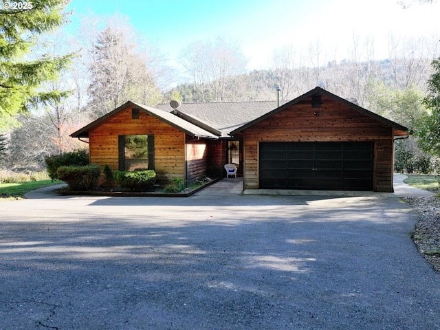 view of front of property with a garage