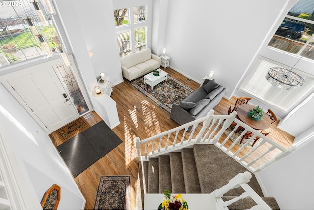 living room featuring stairway and wood finished floors