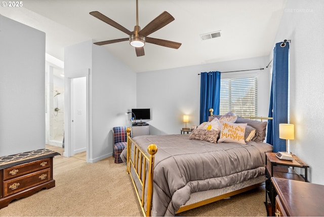 bedroom with lofted ceiling, light colored carpet, visible vents, connected bathroom, and baseboards