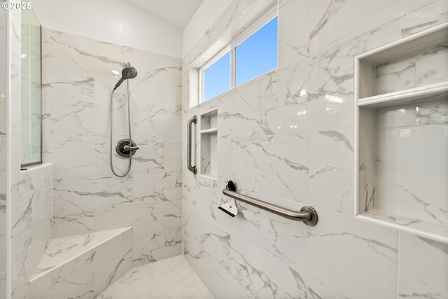 full bath featuring a marble finish shower