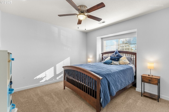 bedroom featuring a ceiling fan, carpet, visible vents, and baseboards