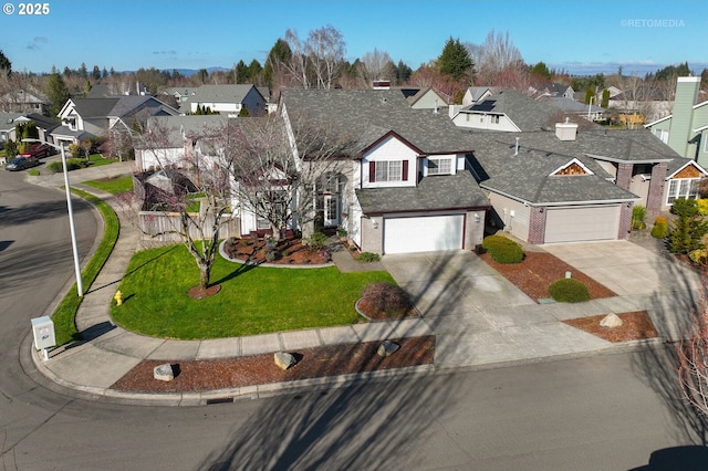 view of front facade featuring a shingled roof, concrete driveway, a residential view, a front lawn, and brick siding