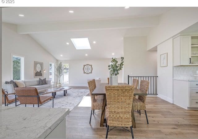 3175 Glen Creek Rd, Salem, OR 97304 - dining area featuring light wood-style flooring, a skylight, recessed lighting, and baseboards