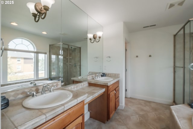 bathroom featuring vanity, visible vents, and a stall shower