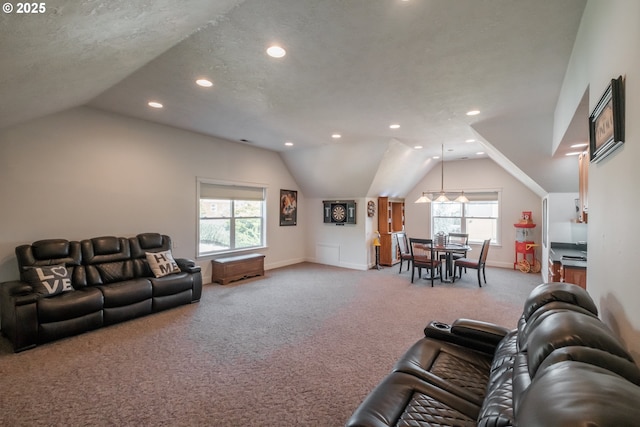 carpeted living room with recessed lighting, a wealth of natural light, and lofted ceiling