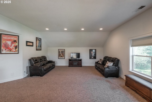 carpeted living area featuring recessed lighting, baseboards, visible vents, and lofted ceiling