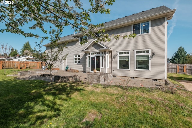 back of house with a yard, a patio, fence, and crawl space
