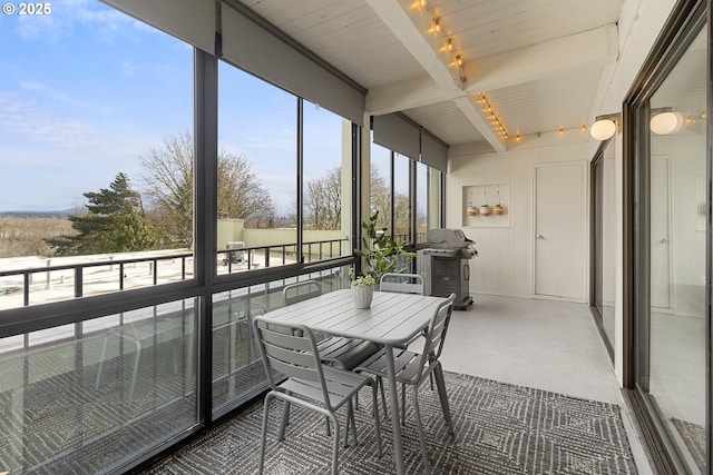 sunroom / solarium with beamed ceiling