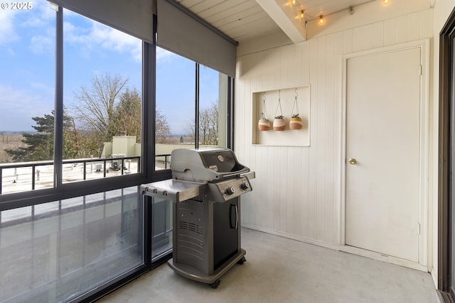 sunroom / solarium with plenty of natural light and beam ceiling