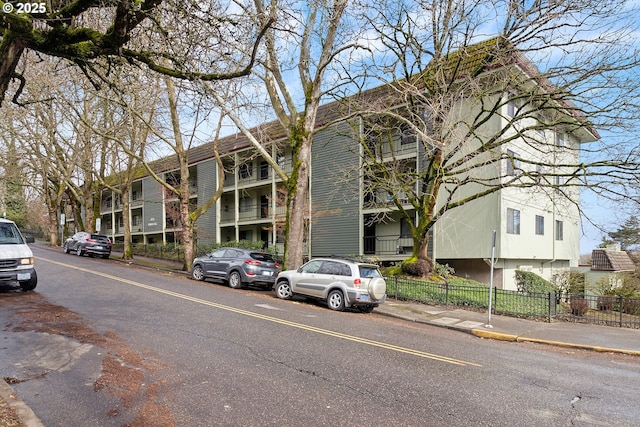 view of building exterior with fence