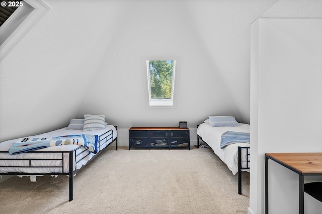 carpeted bedroom featuring vaulted ceiling