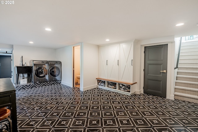 laundry area featuring washer and clothes dryer, baseboards, and recessed lighting