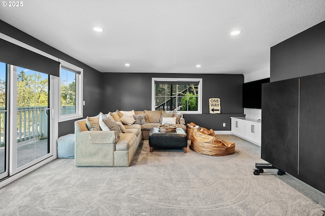 living room featuring carpet floors, plenty of natural light, and recessed lighting