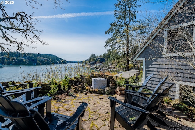 view of patio featuring a water view