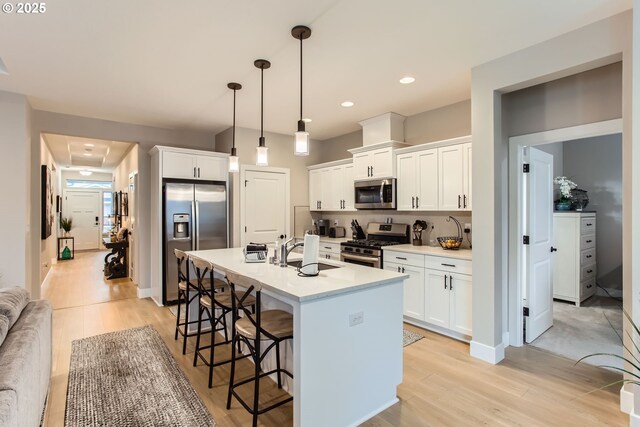 kitchen with white cabinetry, appliances with stainless steel finishes, and sink