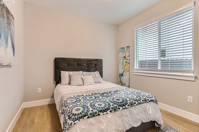 bedroom featuring light hardwood / wood-style floors