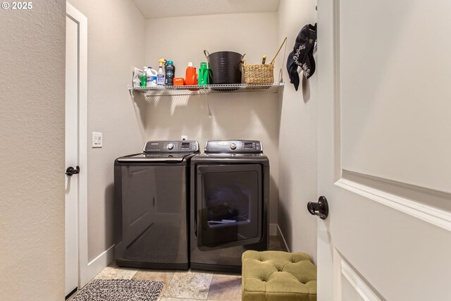 laundry area with washing machine and dryer